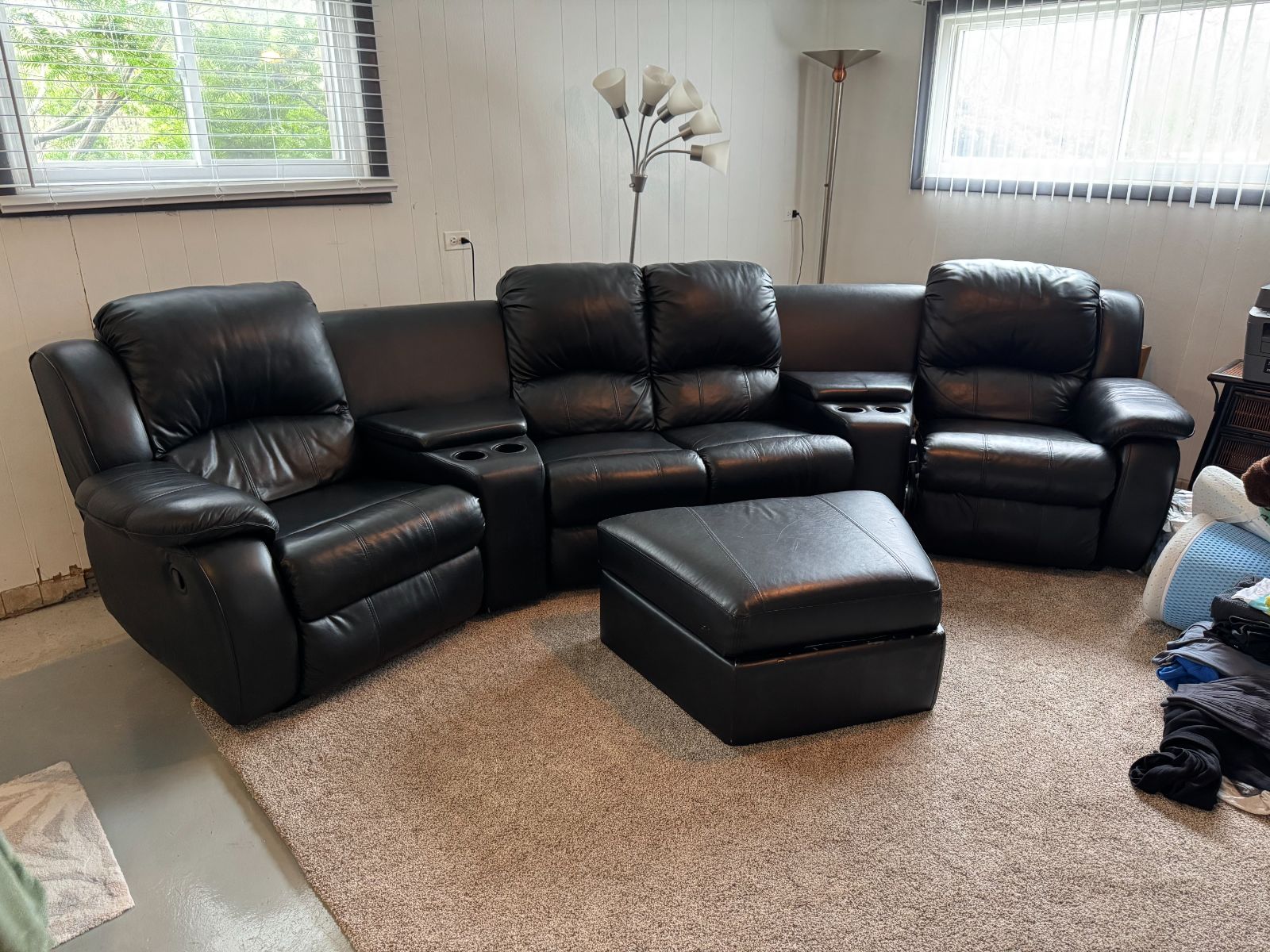 Black Leather Curved Reclining Sectional + Ottoman