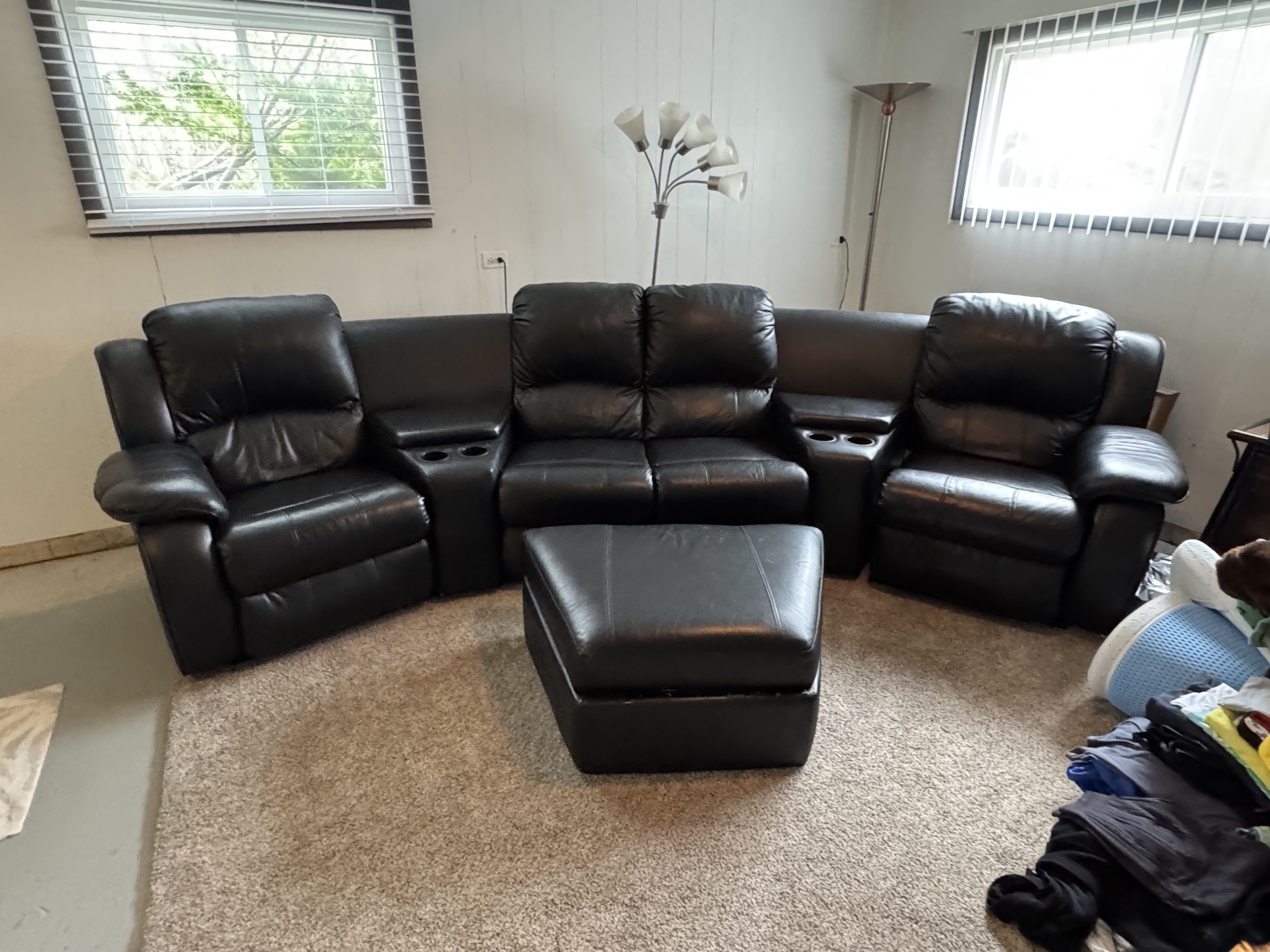 Black Leather Curved Reclining Sectional + Ottoman photo 2
